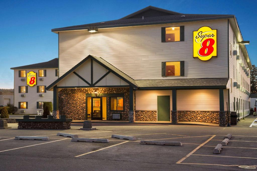 a mcdonalds building in a parking lot at Super 8 by Wyndham Coeur d'Alene in Coeur d'Alene