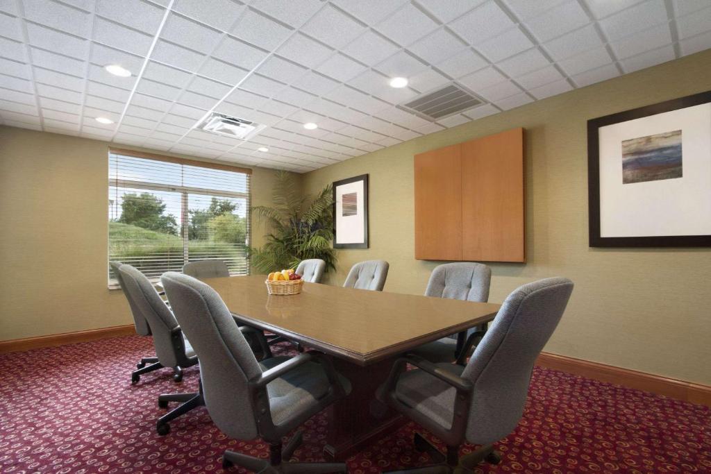 a conference room with a table and chairs at Wingate by Wyndham - Chattanooga in Chattanooga