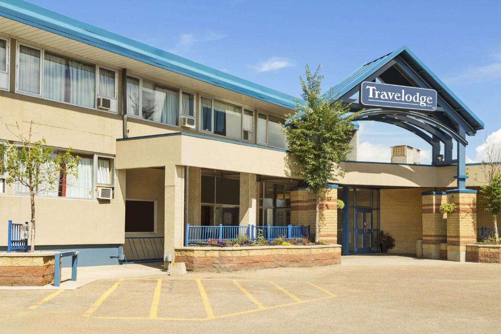 a hotel building with a sign that reads travelodge at Travelodge by Wyndham Edmonton East in Edmonton