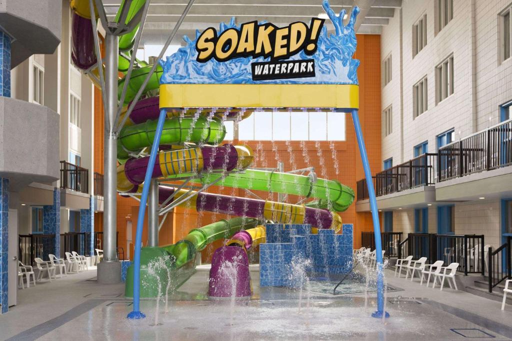 a water park in a mall with a water slide at The Atlas° Hotel in Regina