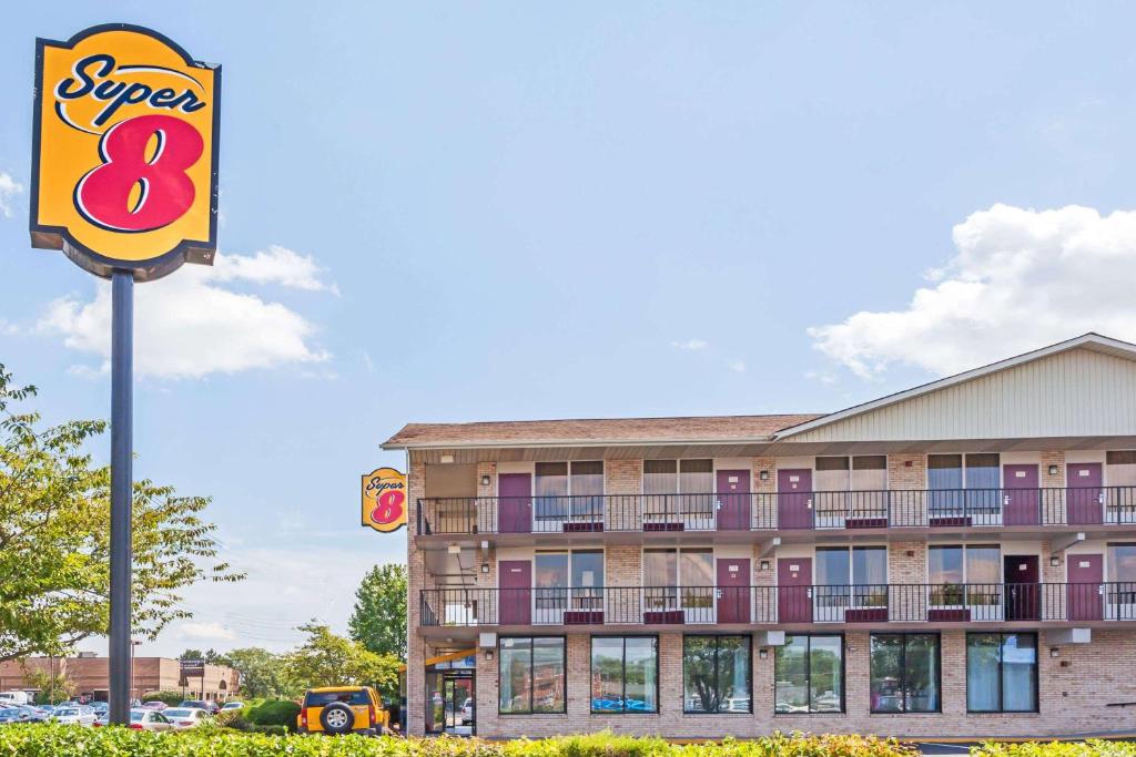 a sign for a super motel in front of a building at Super 8 by Wyndham Manassas in Manassas