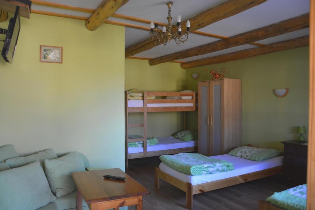 Posteľ alebo postele v izbe v ubytovaní Ranczo w Dolinie