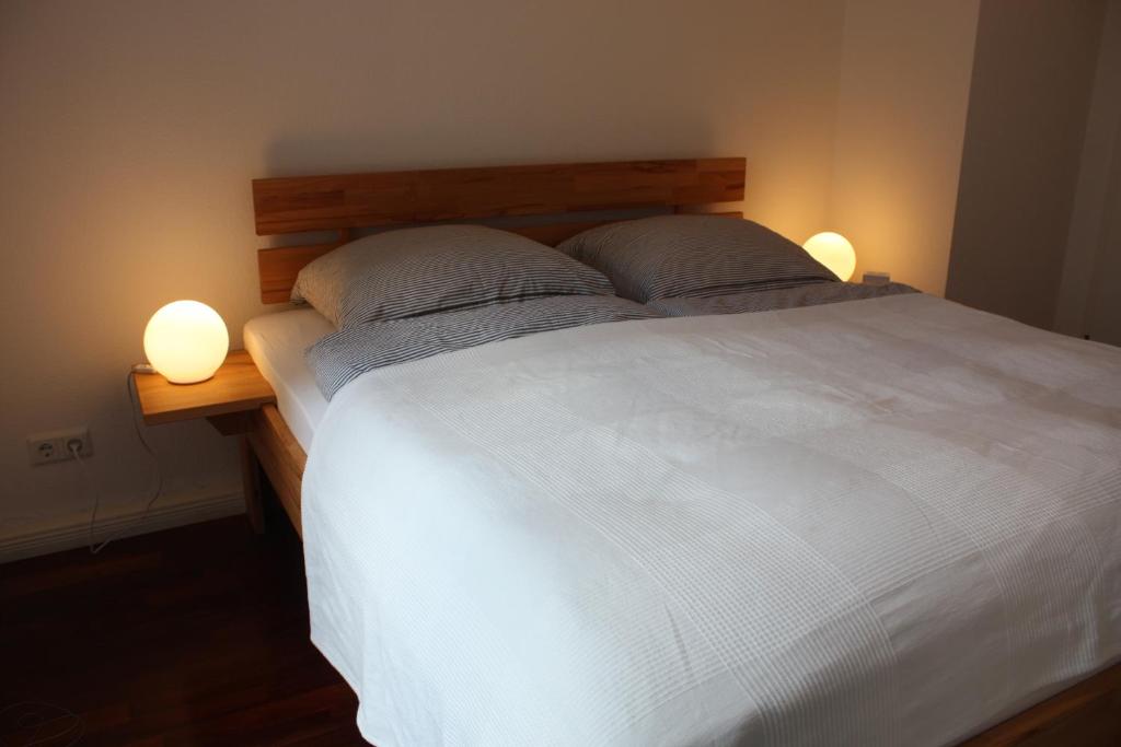 Кровать или кровати в номере Bastians Herberge