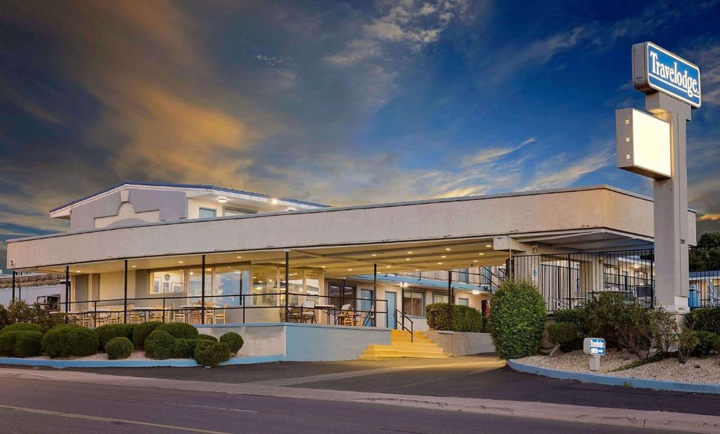 a building with a sign in front of it at Travelodge by Wyndham Page, View of Lake Powell in Page