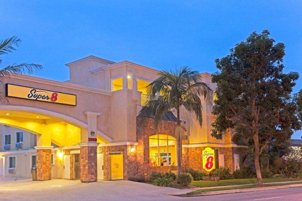 a hotel with a sign on the front of it at Super 8 by Wyndham Torrance LAX Airport Area in Torrance