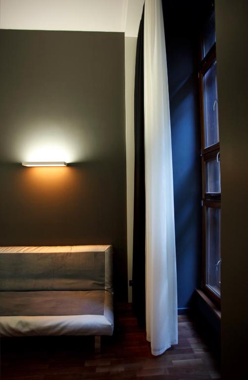 Postel nebo postele na pokoji v ubytování Bohem Art Hotel