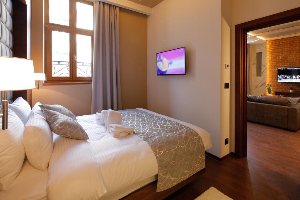 TV a/nebo společenská místnost v ubytování Hotel Passpartù Home Garni