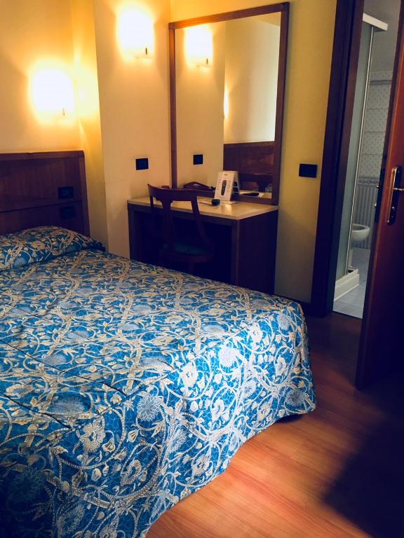 Postel nebo postele na pokoji v ubytování Hotel Ducale