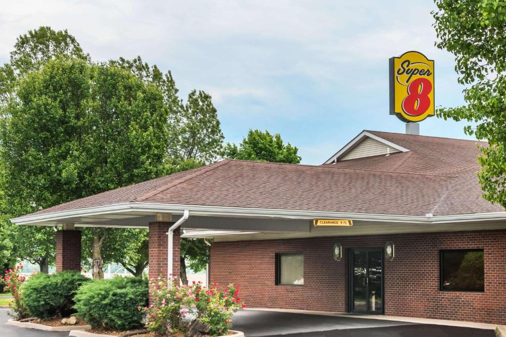 a fast food restaurant with a sign on top of it at Super 8 by Wyndham O'Fallon in O'Fallon