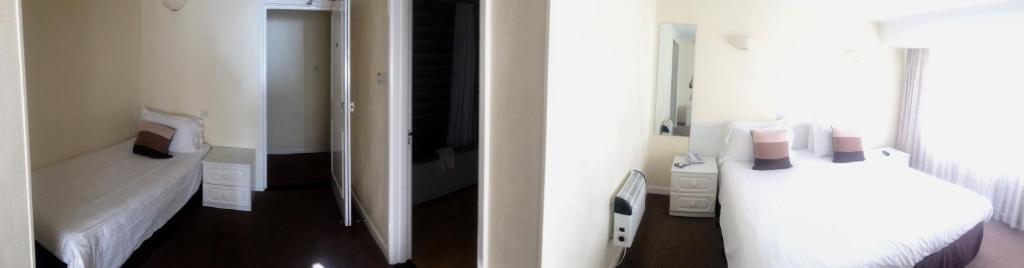 Letto o letti in una camera di Beau Rivage