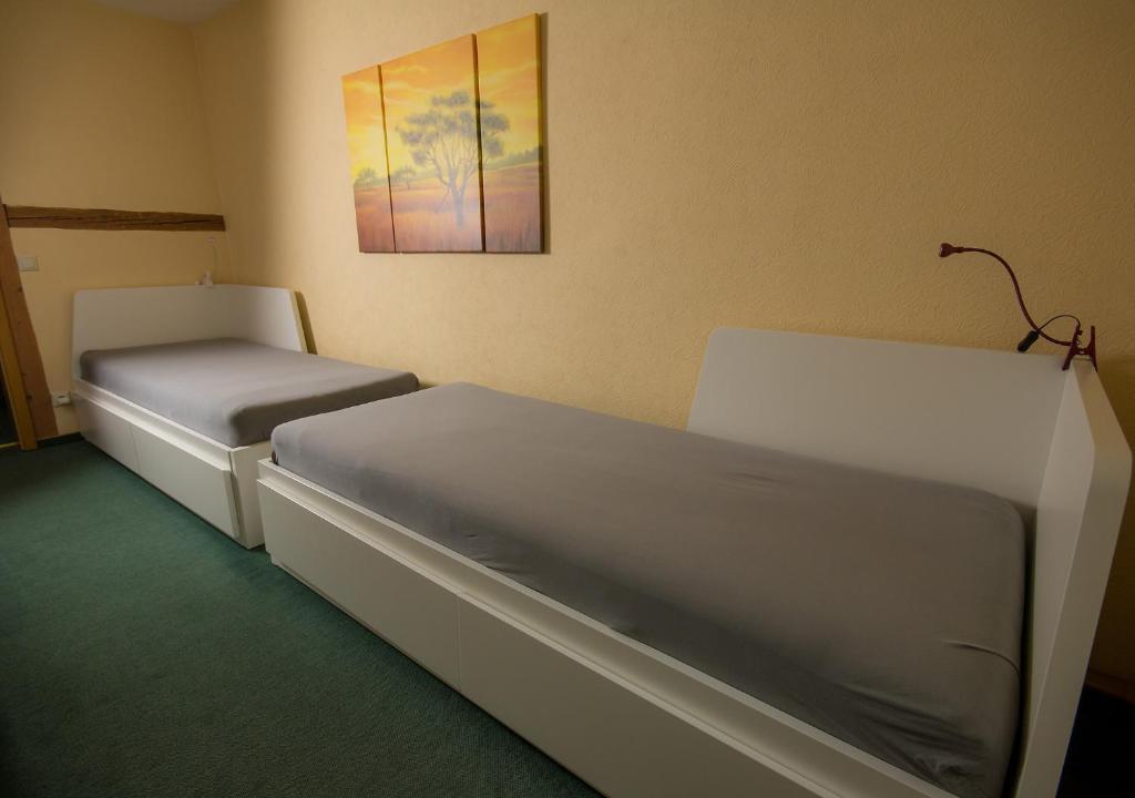Postel nebo postele na pokoji v ubytování Pension Immergrün