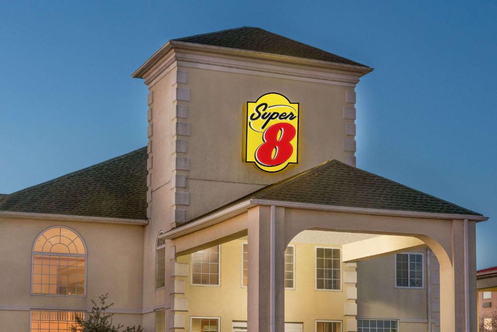 a snow sign on the top of a building at Super 8 by Wyndham Harrisburg Hershey North in Harrisburg