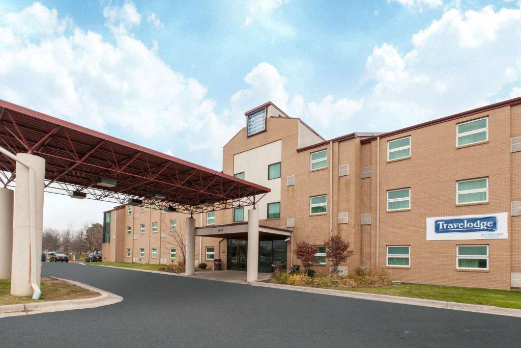 a rendering of a hospital building at Travelodge by Wyndham Romulus Detroit Airport in Romulus