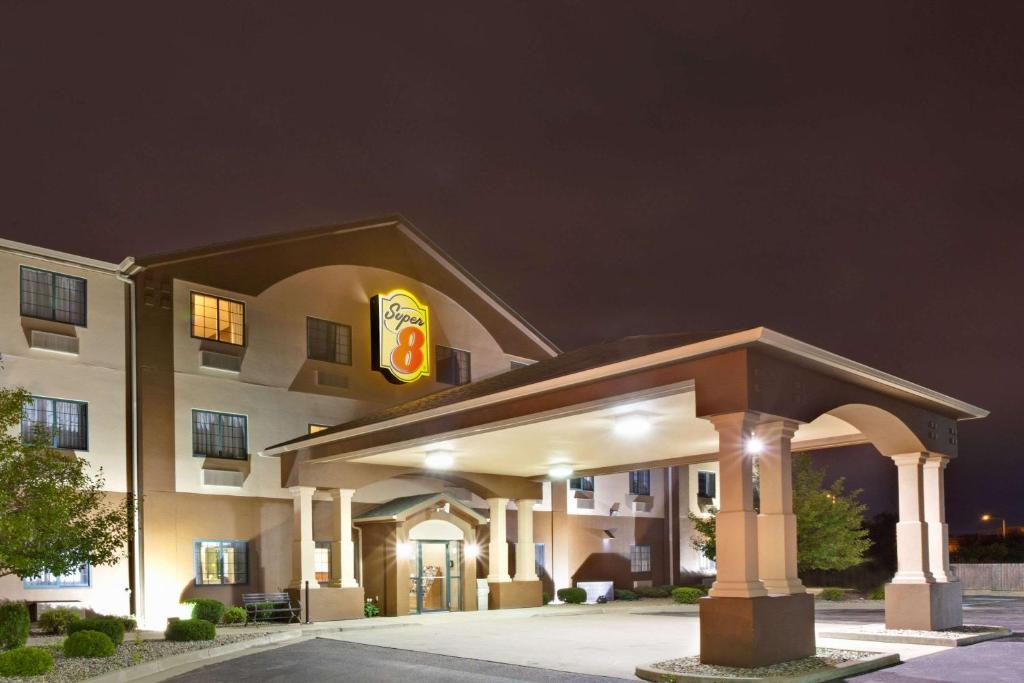 a hotel building with a fast food restaurant at Super 8 by Wyndham South Bend in South Bend