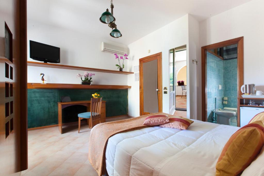Postel nebo postele na pokoji v ubytování Villa Pane Resort