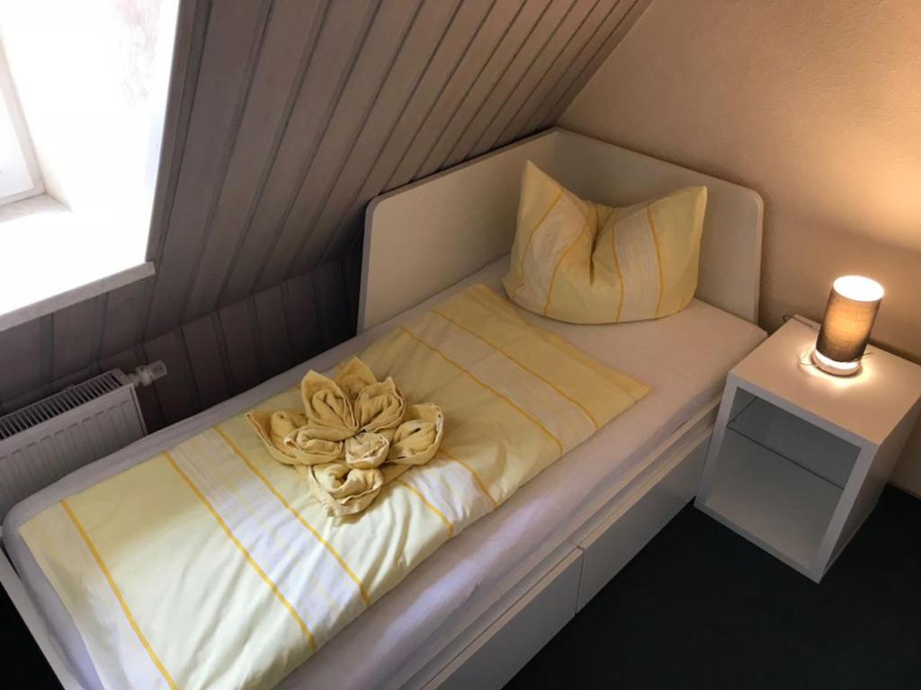 Postel nebo postele na pokoji v ubytování Pension Immergrün