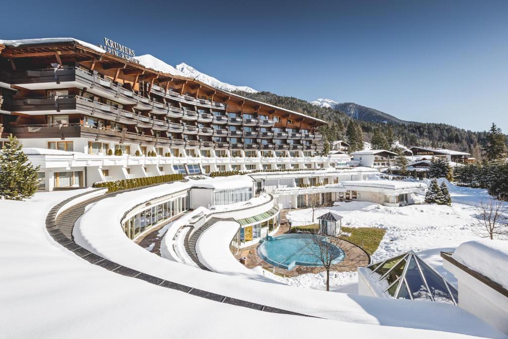arial view of a hotel in the snow at Krumers Alpin – Your Mountain Oasis in Seefeld in Tirol