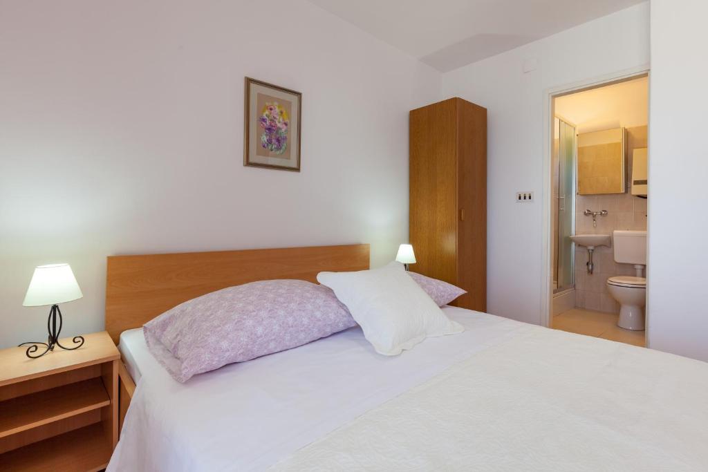 Postel nebo postele na pokoji v ubytování Rooms Marinac