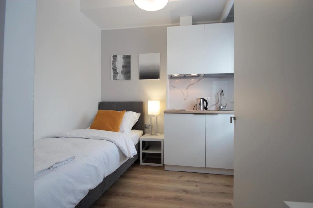 Postel nebo postele na pokoji v ubytování Hotel Coliber
