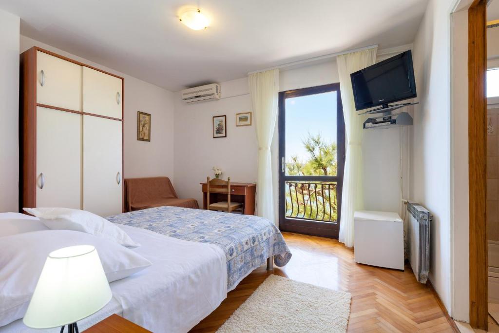 Postel nebo postele na pokoji v ubytování Rooms Marinac