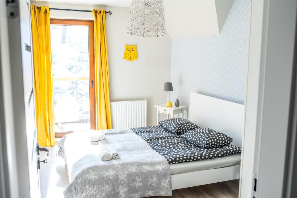 Posteľ alebo postele v izbe v ubytovaní Apartamenty Gubałówka