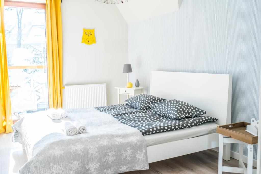 Posteľ alebo postele v izbe v ubytovaní Apartamenty Gubałówka