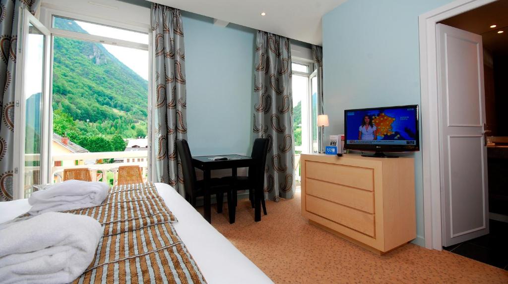 Postel nebo postele na pokoji v ubytování Golf Hôtel