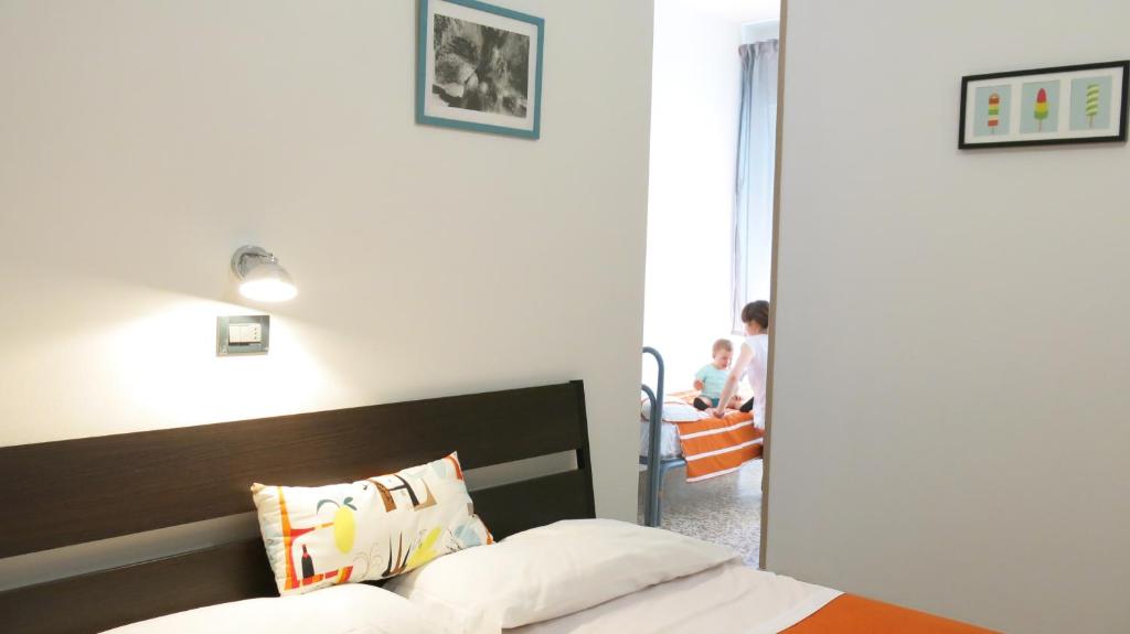 Postel nebo postele na pokoji v ubytování Hotel Paris