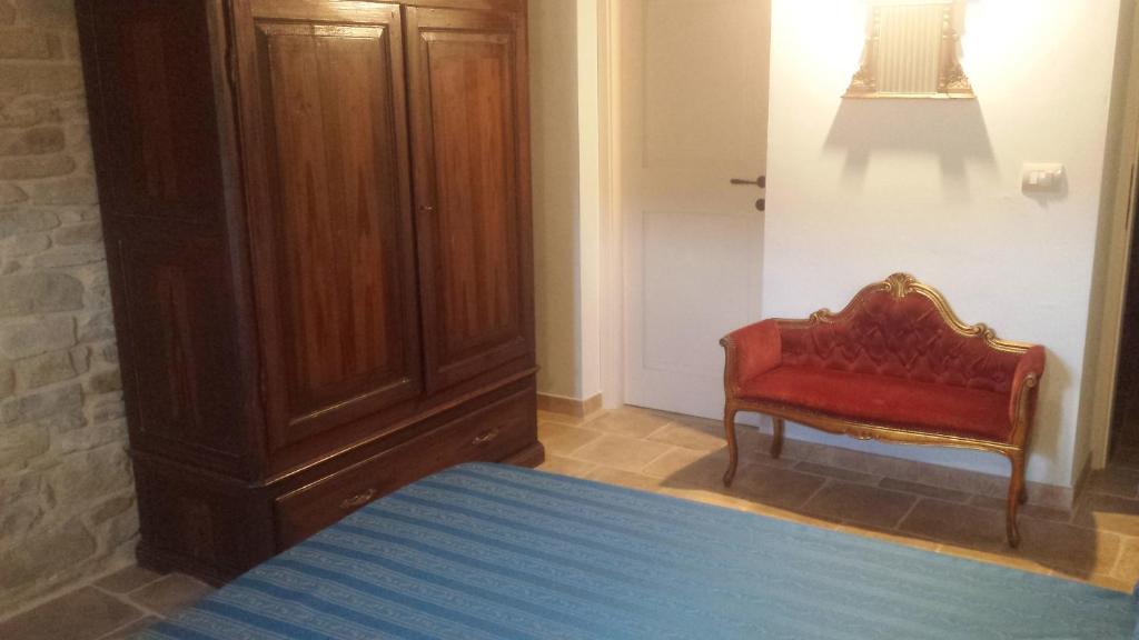 Postel nebo postele na pokoji v ubytování Valbuona B&B