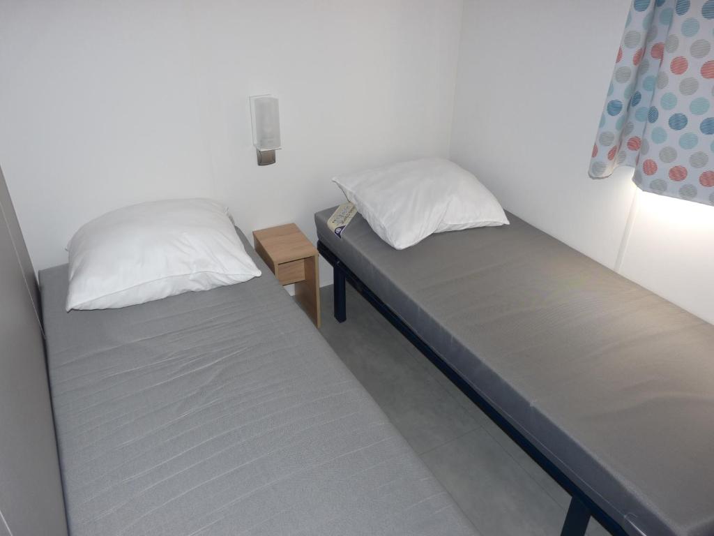 Postel nebo postele na pokoji v ubytování Beachside Vakantiepark