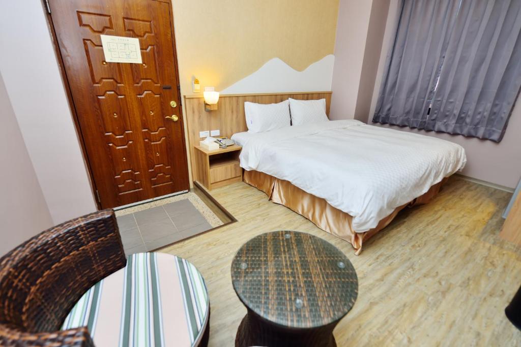 Voodi või voodid majutusasutuse Fu Yu Spring House toas