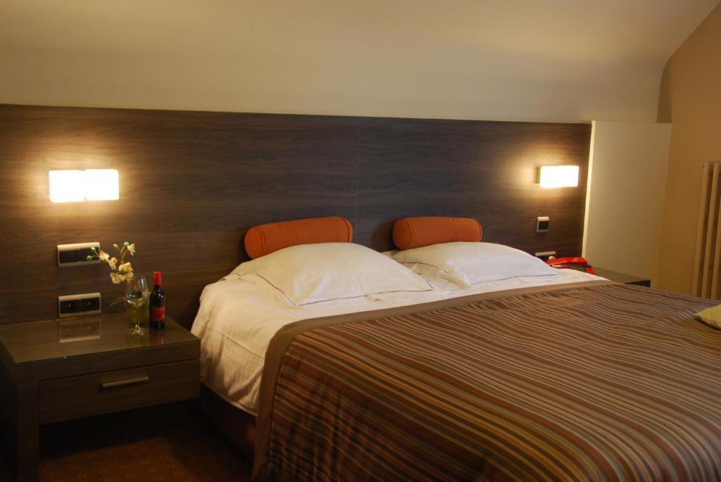 Postel nebo postele na pokoji v ubytování Hotel Rubens
