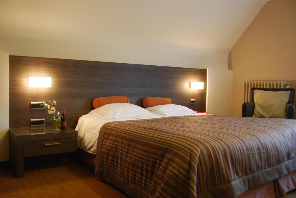 Postel nebo postele na pokoji v ubytování Hotel Rubens