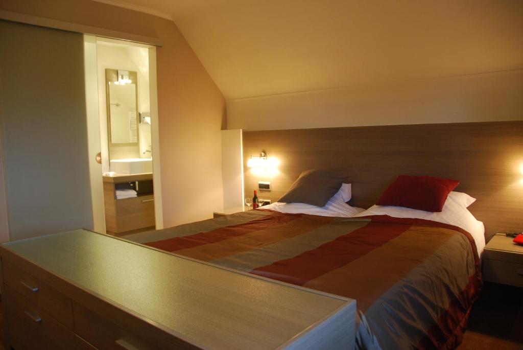 Postel nebo postele na pokoji v ubytování Hotel Rubens