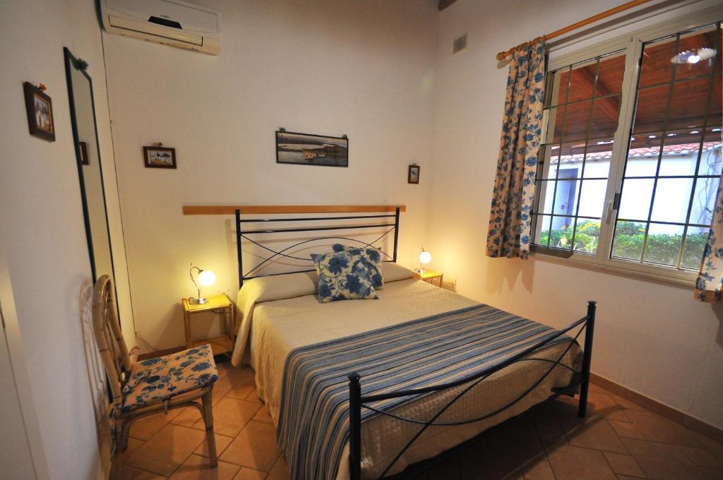 Postel nebo postele na pokoji v ubytování B&B Il Mandorleto Avola