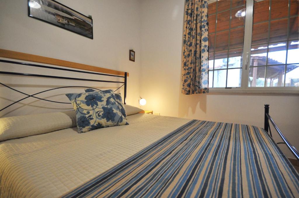 Postel nebo postele na pokoji v ubytování B&B Il Mandorleto Avola