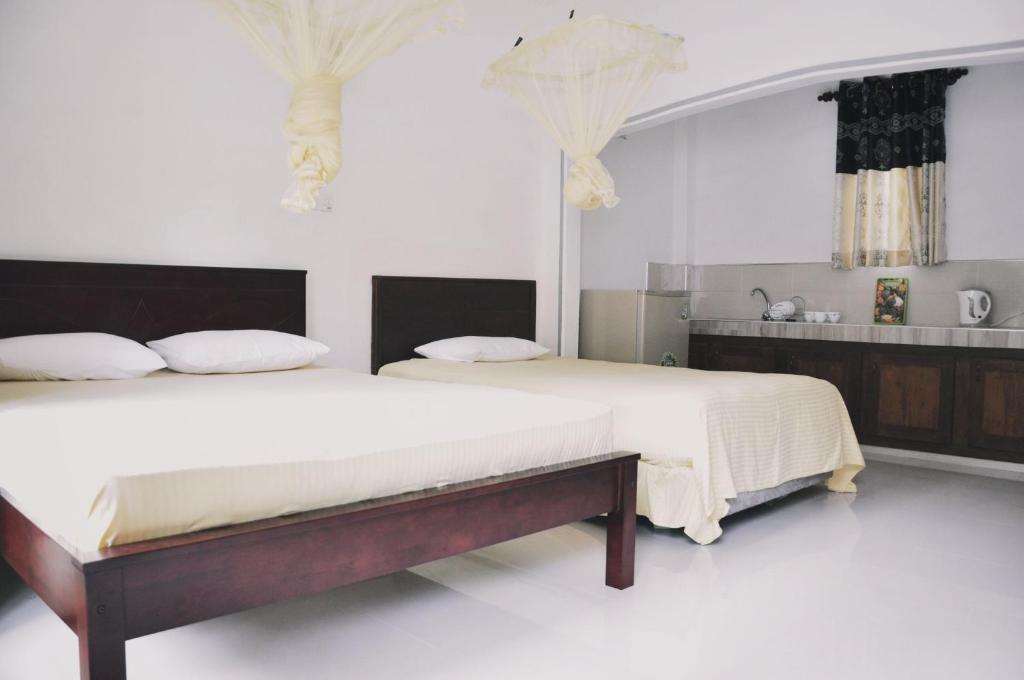 Postel nebo postele na pokoji v ubytování Medawatta Villa