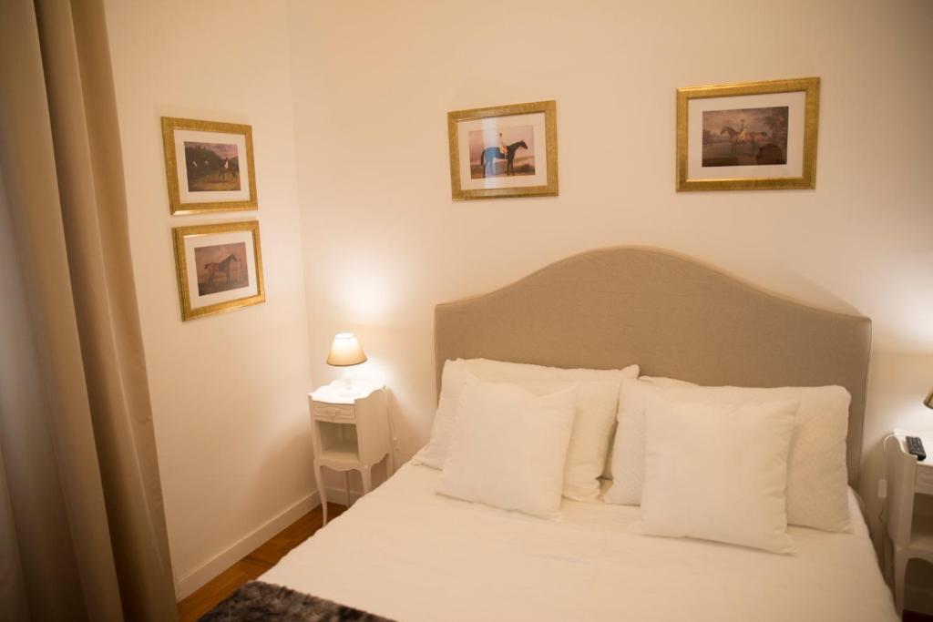 A bed or beds in a room at St Paul House Boutique & Apartment