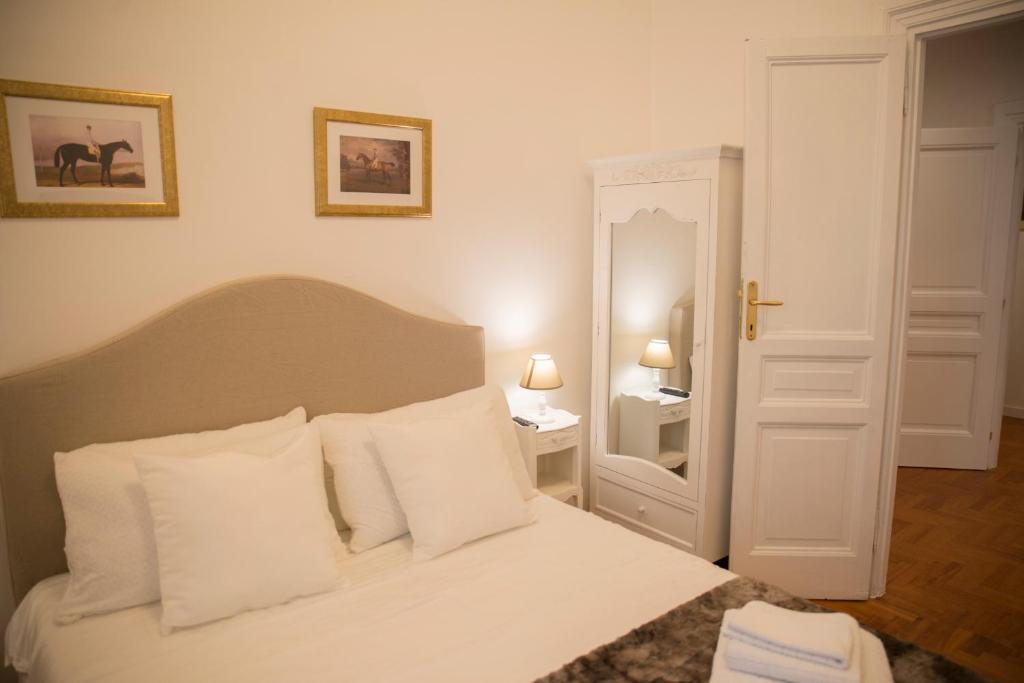 A bed or beds in a room at St Paul House Boutique & Apartment