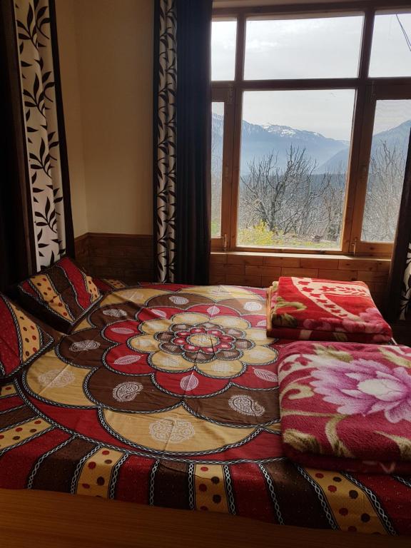 Postel nebo postele na pokoji v ubytování Sunface Homestay