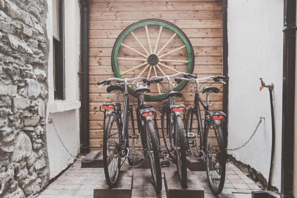 a group of bikes parked next to a garage at The Black Sheep Hostel in Killarney
