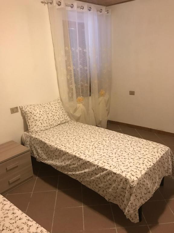 Posteľ alebo postele v izbe v ubytovaní Agriturismo Il Maremmano