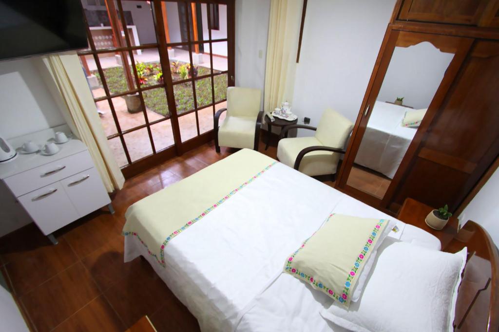 מיטה או מיטות בחדר ב-Casa Kuelap Hostal