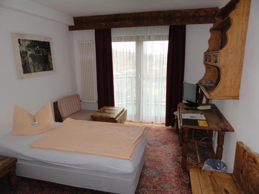 Postel nebo postele na pokoji v ubytování Solitaire Hotel