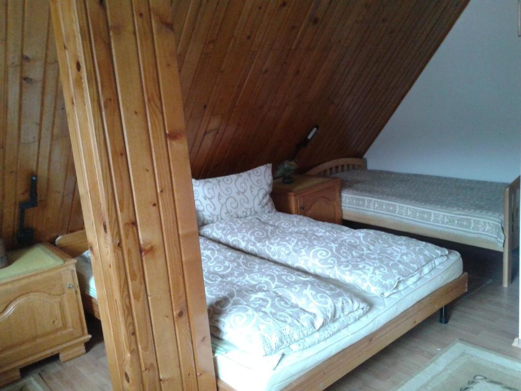 Postel nebo postele na pokoji v ubytování Csaki Vendeghaz