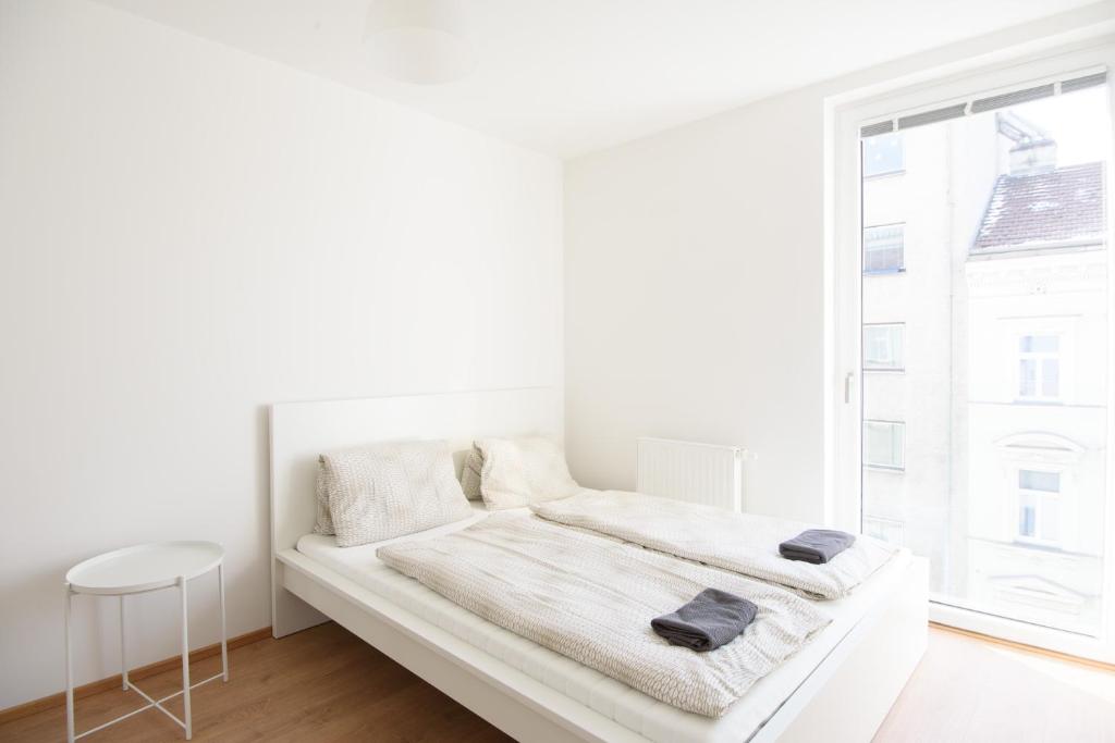 Posteľ alebo postele v izbe v ubytovaní Vienna City Apartments 1100 Vienna