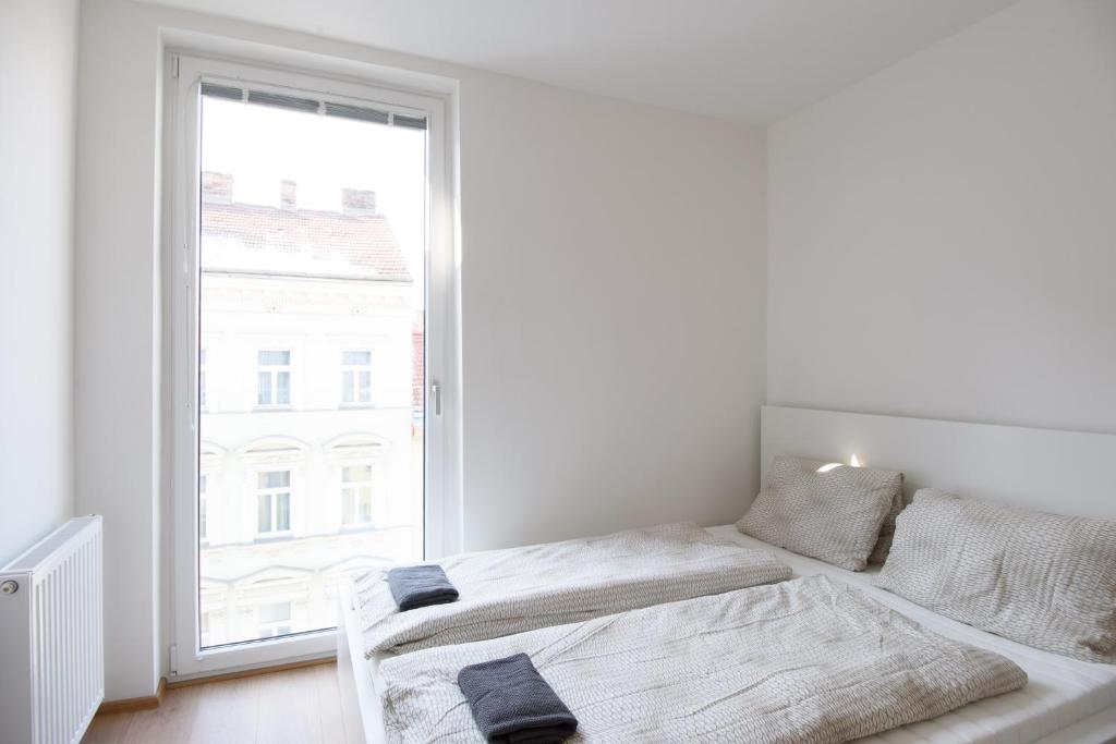 Posteľ alebo postele v izbe v ubytovaní Vienna City Apartments 1100 Vienna
