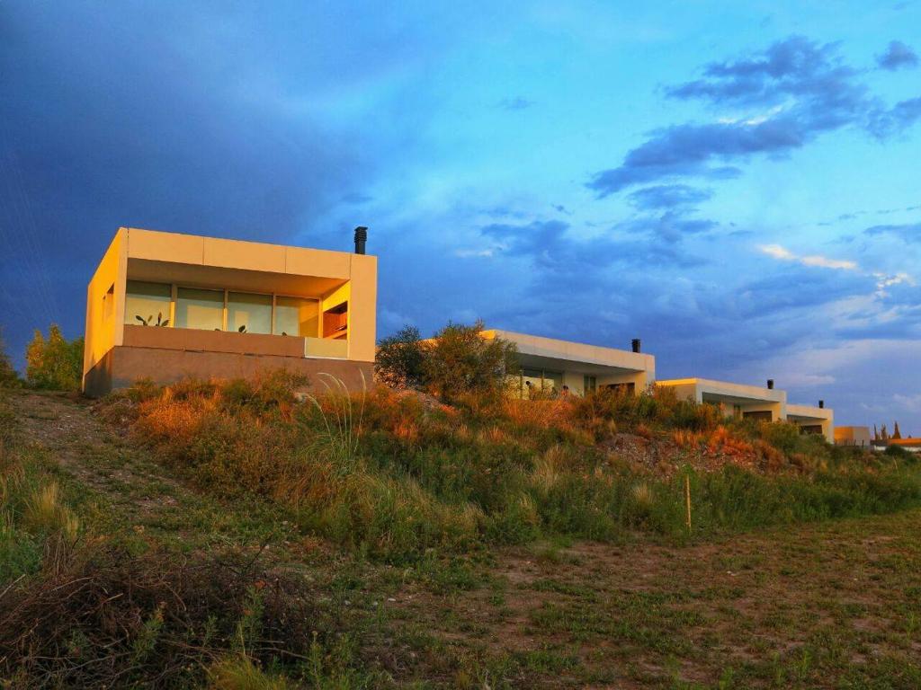 a house sitting on top of a hill at Barrancas Suites in San Rafael