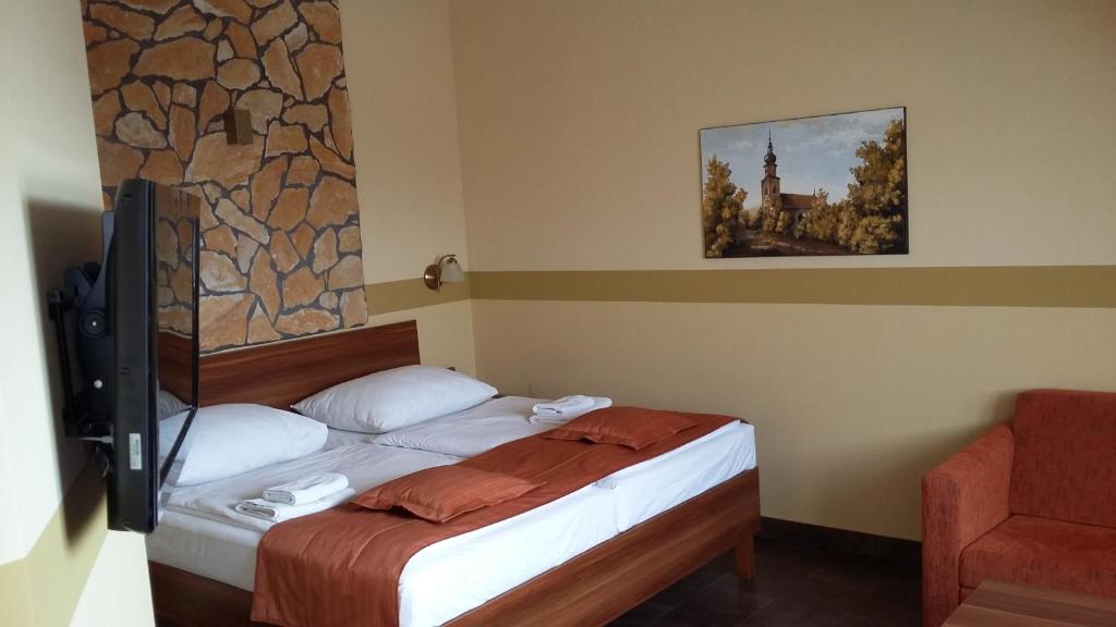 Postel nebo postele na pokoji v ubytování Hotel Vinopa