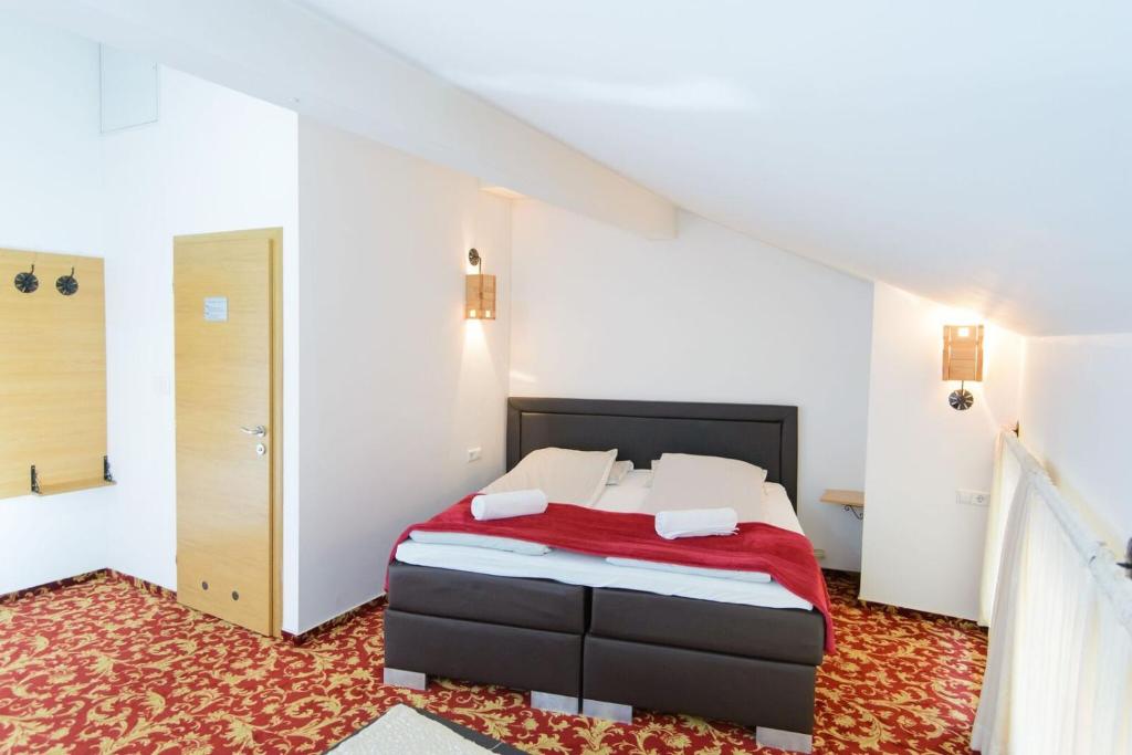 Postel nebo postele na pokoji v ubytování Residence Mahala